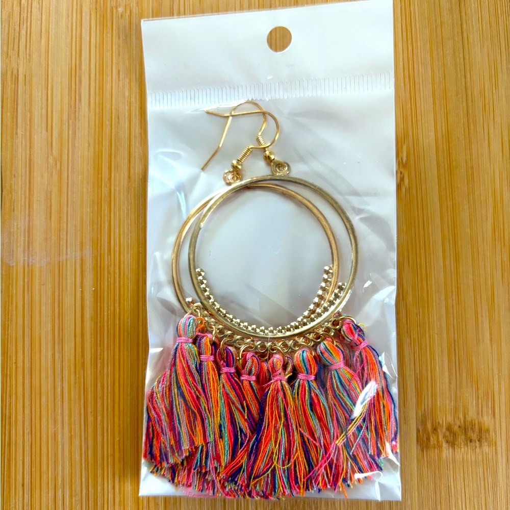 Fringe hoop earrings with multicolor thread. Never opened or worn.